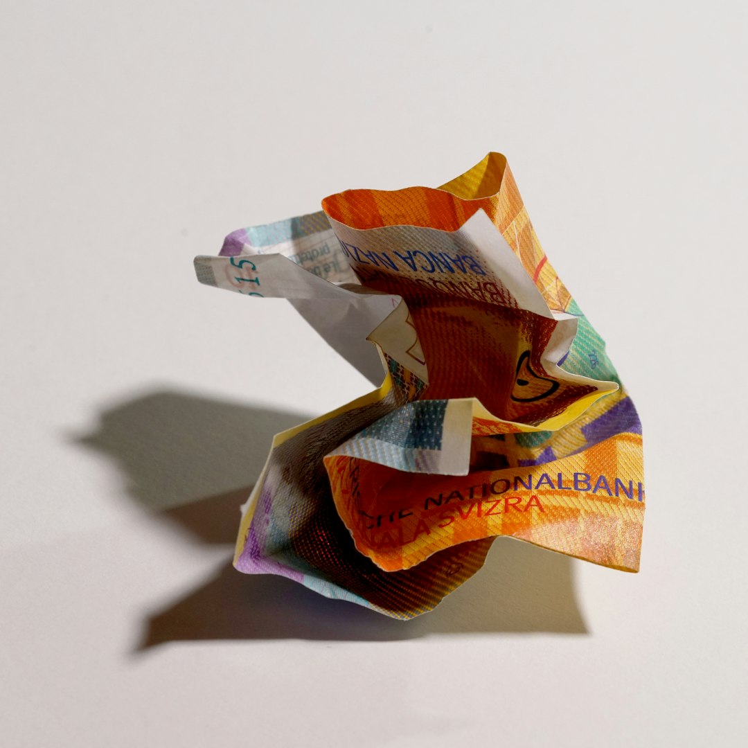 a folded origami piece of paper on a white surface